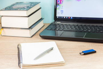 computer laptop with books